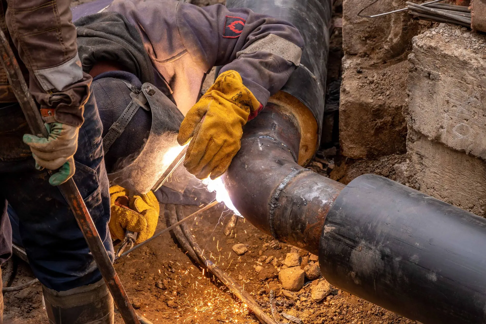 Welder joining a pipeline