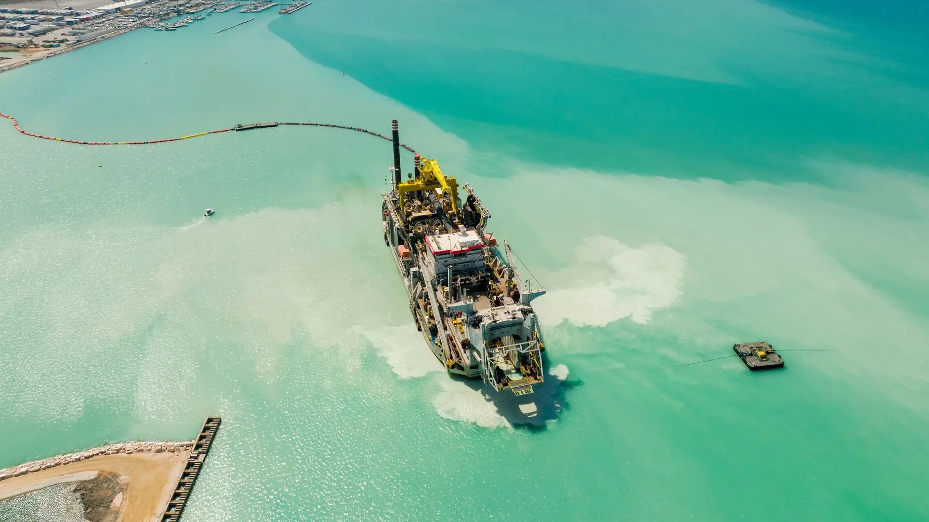 Dredging vessel working in turquoise water